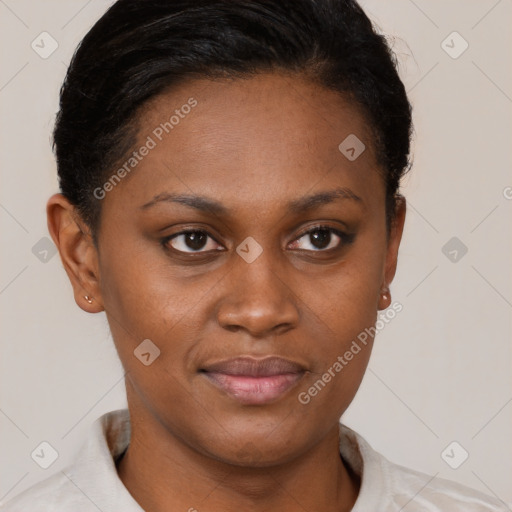 Joyful black young-adult female with short  brown hair and brown eyes