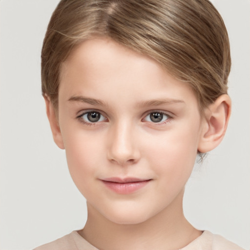 Joyful white child female with short  brown hair and brown eyes