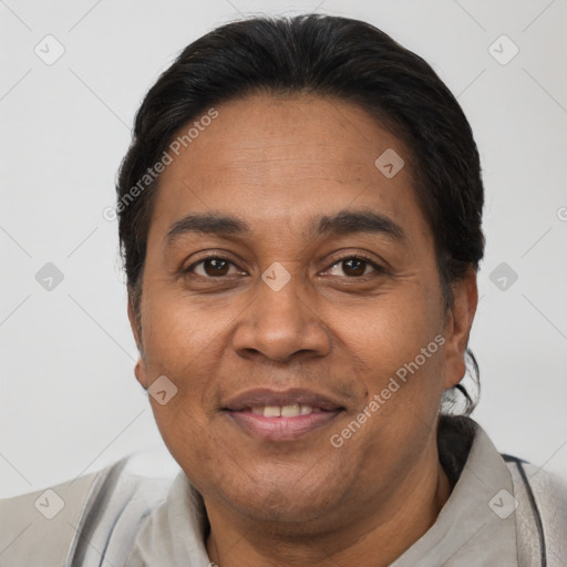 Joyful latino adult male with short  brown hair and brown eyes