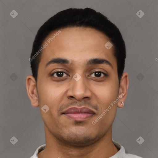 Joyful latino young-adult male with short  brown hair and brown eyes