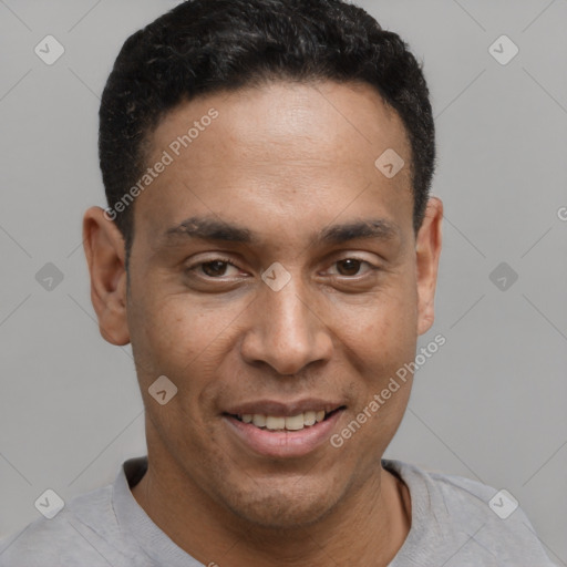 Joyful latino young-adult male with short  brown hair and brown eyes