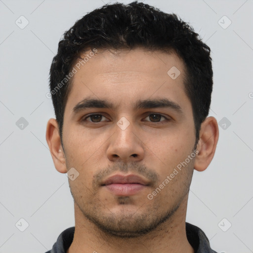 Neutral white young-adult male with short  black hair and brown eyes