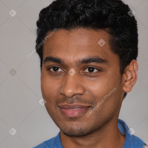 Joyful black young-adult male with short  black hair and brown eyes