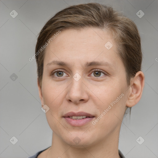 Joyful white adult female with short  brown hair and grey eyes