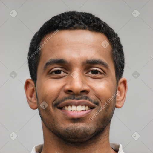 Joyful latino young-adult male with short  black hair and brown eyes