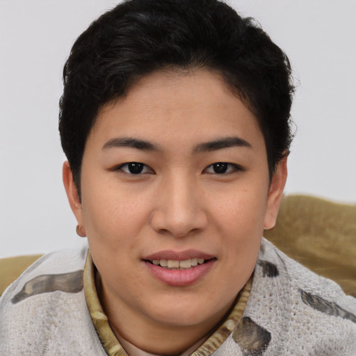 Joyful asian young-adult female with short  brown hair and brown eyes