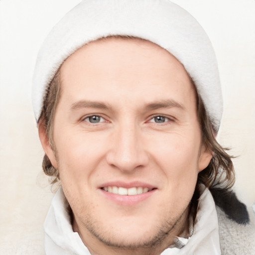 Joyful white young-adult male with medium  brown hair and brown eyes