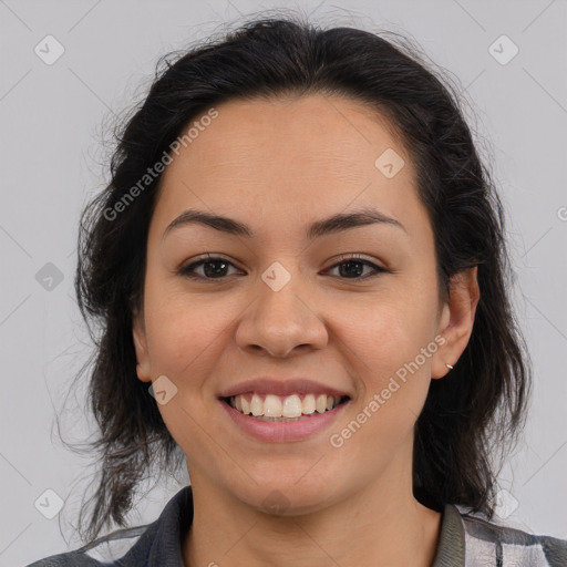 Joyful latino young-adult female with medium  brown hair and brown eyes