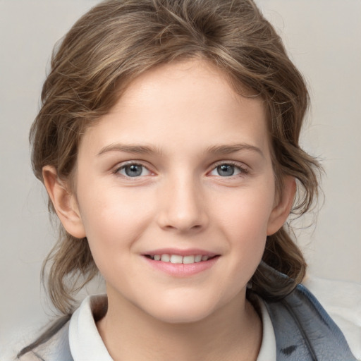 Joyful white child female with medium  brown hair and grey eyes