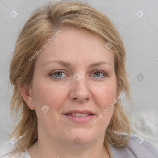 Joyful white adult female with medium  brown hair and blue eyes