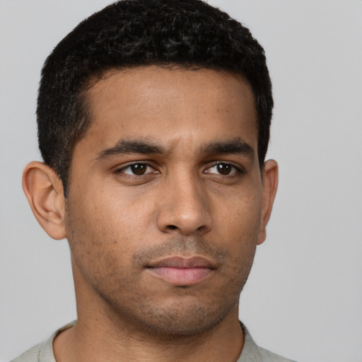 Neutral black young-adult male with short  brown hair and brown eyes