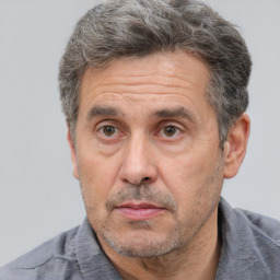 Neutral white middle-aged male with short  brown hair and brown eyes