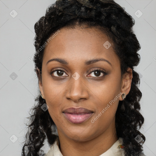 Joyful black young-adult female with long  black hair and brown eyes