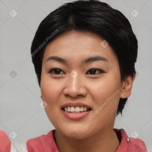 Joyful asian young-adult female with short  black hair and brown eyes