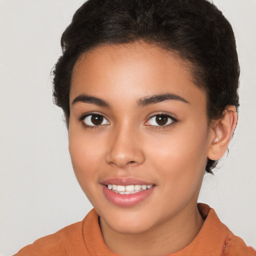 Joyful latino young-adult female with short  brown hair and brown eyes