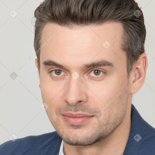 Joyful white young-adult male with short  brown hair and brown eyes