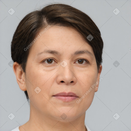 Joyful white adult female with short  brown hair and brown eyes