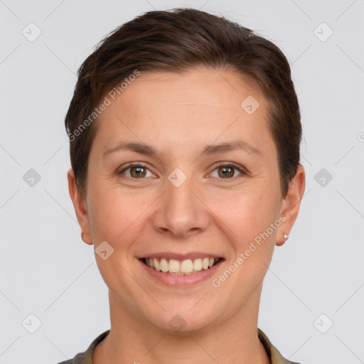 Joyful white young-adult female with short  brown hair and grey eyes