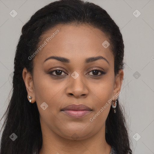 Joyful black young-adult female with long  brown hair and brown eyes