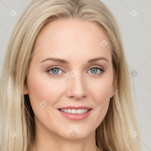 Joyful white young-adult female with long  brown hair and blue eyes