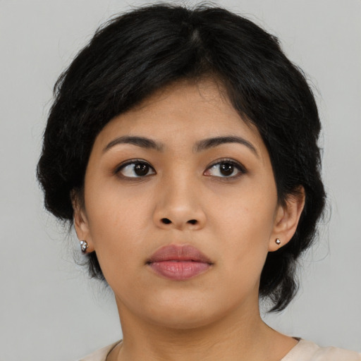 Neutral asian young-adult female with medium  black hair and brown eyes