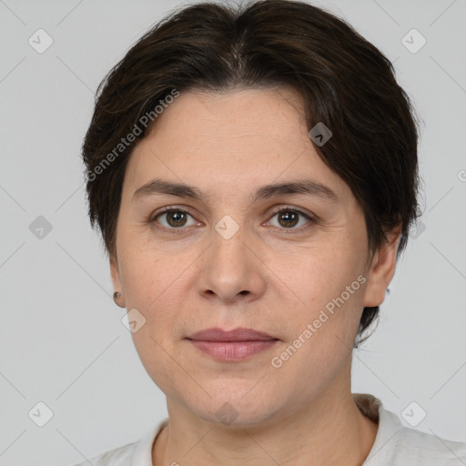 Joyful white adult female with short  brown hair and brown eyes