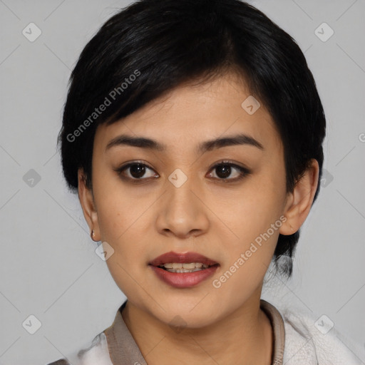 Joyful asian young-adult female with medium  black hair and brown eyes