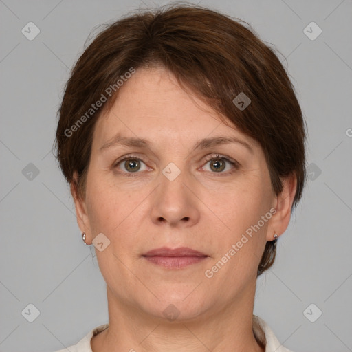 Joyful white adult female with short  brown hair and grey eyes