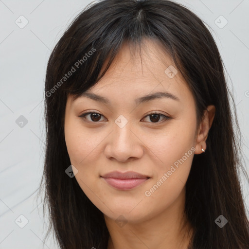 Joyful asian young-adult female with long  brown hair and brown eyes