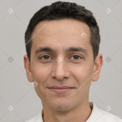 Joyful white adult male with short  brown hair and brown eyes