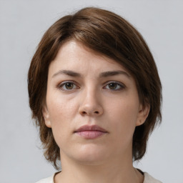 Neutral white young-adult female with medium  brown hair and brown eyes