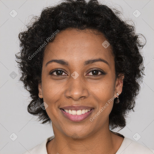 Joyful black young-adult female with long  brown hair and brown eyes