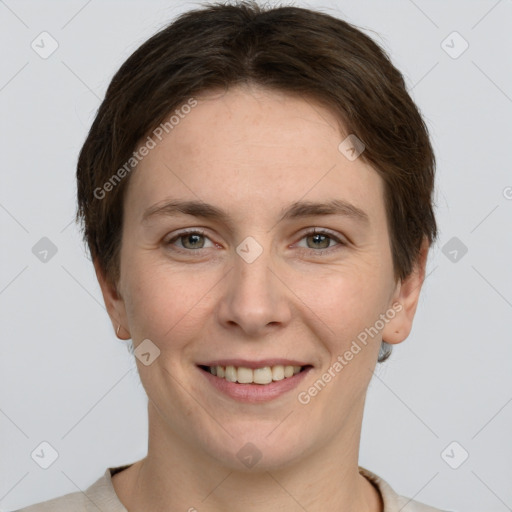 Joyful white adult female with short  brown hair and grey eyes