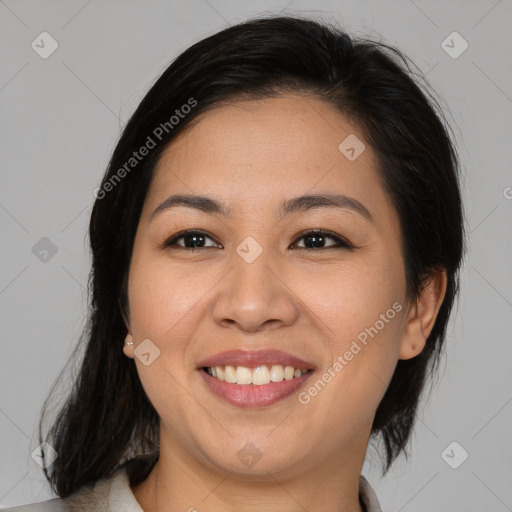 Joyful latino young-adult female with medium  brown hair and brown eyes