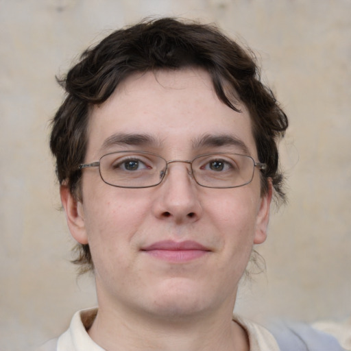 Joyful white young-adult male with medium  brown hair and brown eyes