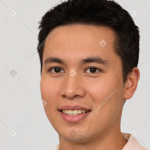 Joyful white young-adult male with short  black hair and brown eyes