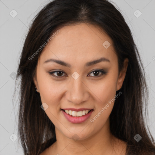 Joyful latino young-adult female with long  brown hair and brown eyes