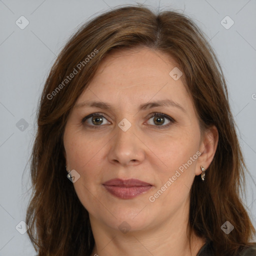 Joyful white adult female with long  brown hair and brown eyes