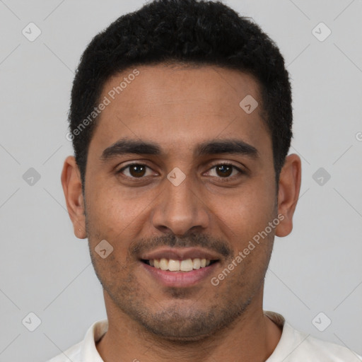 Joyful latino young-adult male with short  brown hair and brown eyes