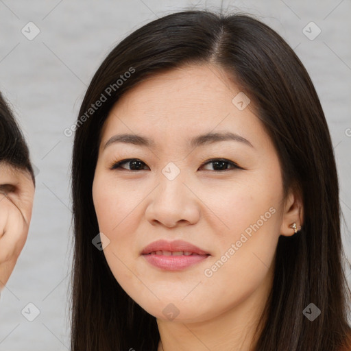 Joyful asian young-adult female with long  brown hair and brown eyes