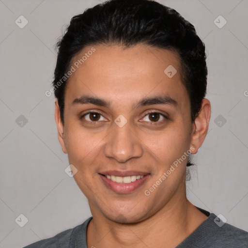 Joyful white young-adult male with short  black hair and brown eyes