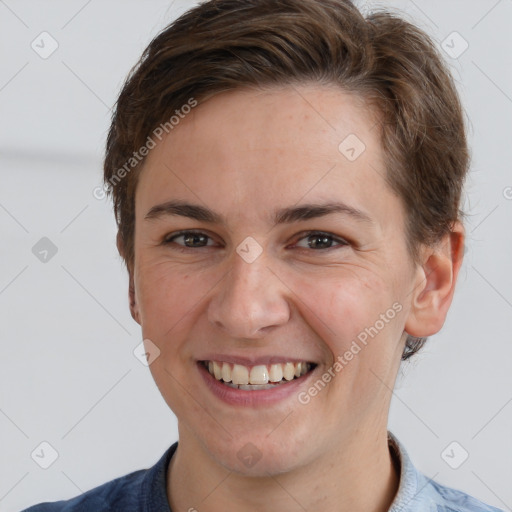 Joyful white adult female with short  brown hair and grey eyes