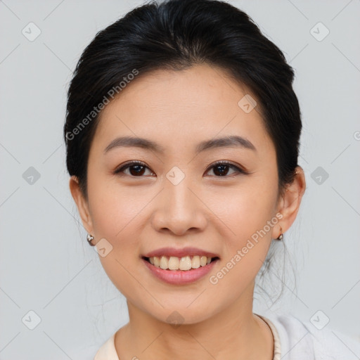 Joyful asian young-adult female with medium  brown hair and brown eyes