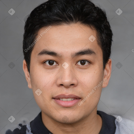 Joyful asian young-adult male with short  brown hair and brown eyes