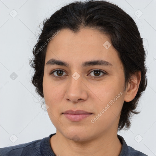 Joyful latino young-adult female with medium  brown hair and brown eyes