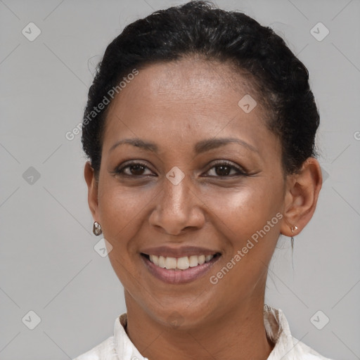 Joyful black adult female with short  brown hair and brown eyes