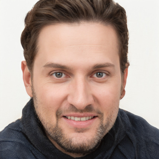 Joyful white young-adult male with short  brown hair and brown eyes