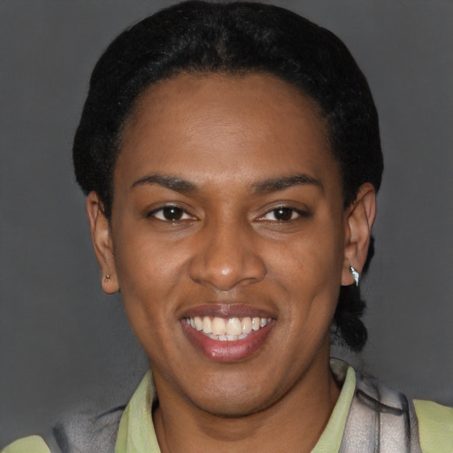 Joyful latino young-adult female with short  black hair and brown eyes