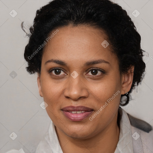 Joyful black adult female with short  brown hair and brown eyes