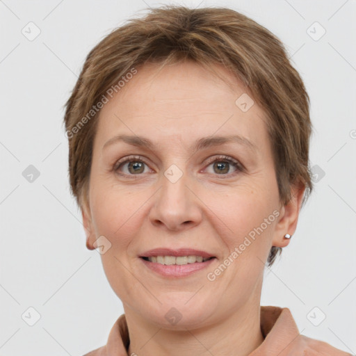 Joyful white adult female with short  brown hair and grey eyes